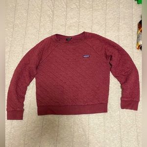 Medium dark red Patagonia sweatshirt.